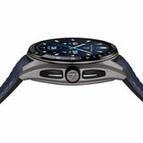 TAG Heuer Connected Calibre E5 x TaylorMade Edition SBT8A86.EB0421 photographed from a side profile, showing the case thickness and rotating crown. The black and blue strap and ceramic bezel are visible together in frame.