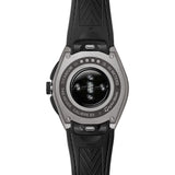 TAG Heuer Connected Calibre E5 x TaylorMade Edition SBT8A86.EB0421 shown from the case-back, displaying the sensor array and charging contacts. The black and blue strap is visible alongside the case-back detail.