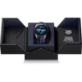 TAG Heuer Connected Calibre E5 x TaylorMade Edition SBT8A86.EB0421 presented in its packaging alongside the included complimentary strap and charging dock. The co-branded TAG Heuer and TaylorMade detailing is visible on the packaging.