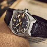The King Seiko Vanac Automatic Men's 41mm Watch SLA093J reveals the dial's fine texture and golden accents in close detail.