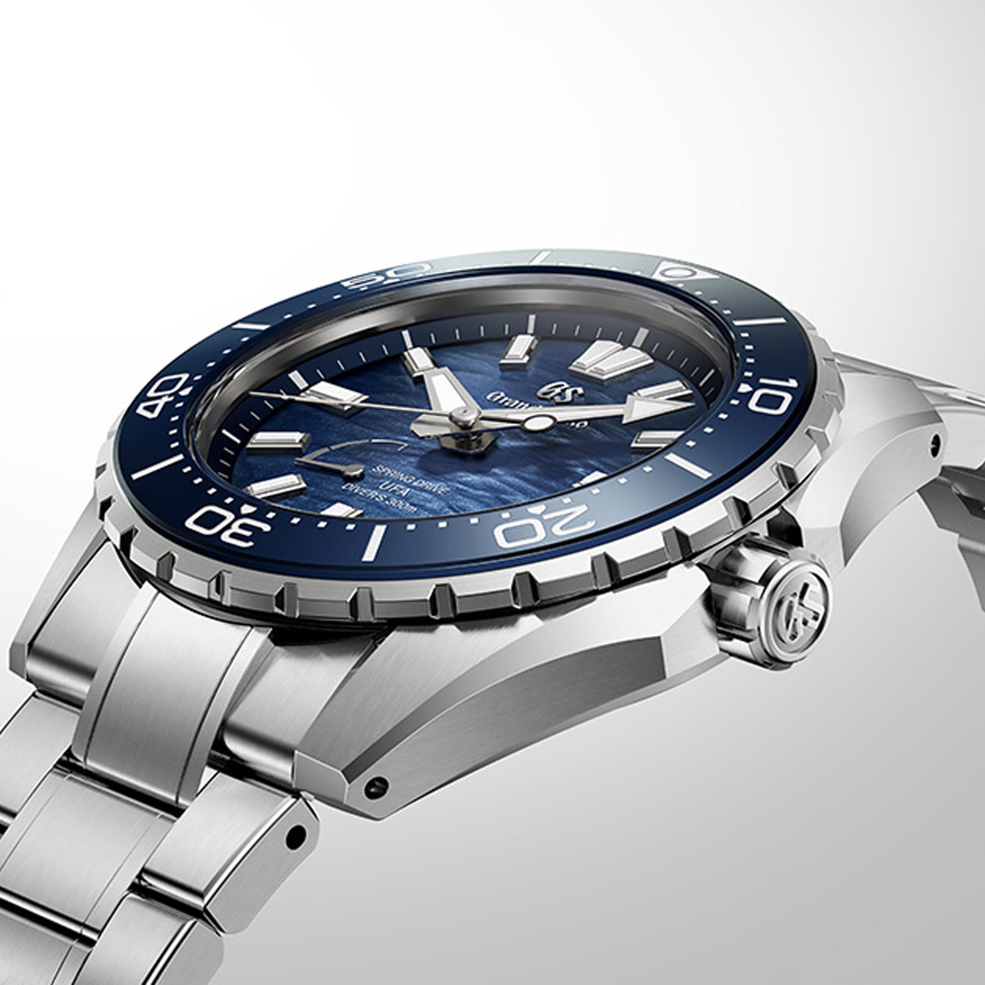 Side profile of the Grand Seiko Evolution 9 SLGB023 men's diver's watch, showing the 12.9mm case thickness in High-Intensity Titanium. The unidirectional rotating bezel and screw-down crown are visible along the case edge.