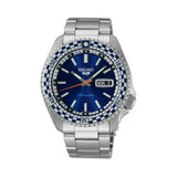The Seiko 5 Sports Automatic Men’s 42.50mm Watch SRPK65K has a petrol blue dial with LumiBrite hands and markers and a day-date window. The 42.5mm steel case has a white-and-blue checkered bezel.