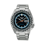 The Seiko 5 Sports SKX Series Men’s 42.50mm Watch SRPK67K has a black dial with LumiBrite hands and markers and a day-date window. The 42.5mm steel case has a black-and-silver checkered bezel.
