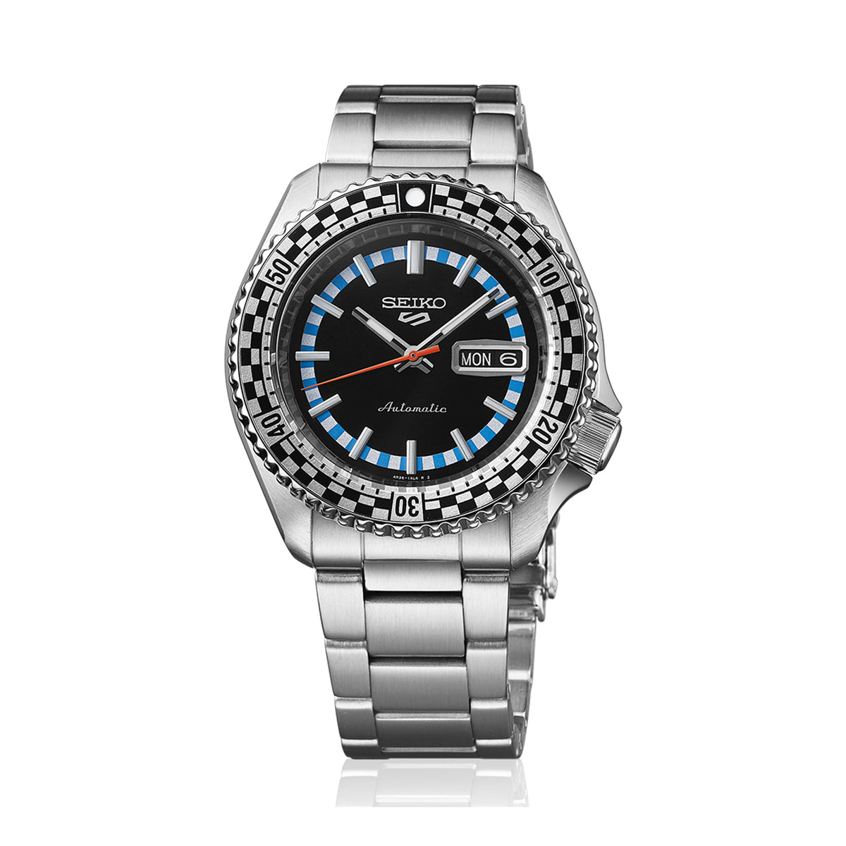 From this angle, the Seiko 5 Sports SKX Series Men’s 42.50mm Watch SRPK67K shows the black dial and checkered bezel together. The brushed and polished steel case frames the dial.