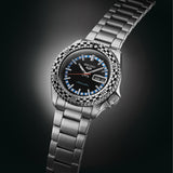 The Seiko 5 Sports SKX Series Men’s 42.50mm Watch SRPK67K shows the dial’s baton markers, vintage-style hands and day-date window. The checkered bezel insert sits around the dial.