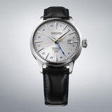 From this angle, the Seiko Presage Cocktail Time Automatic GMT Men's 40.50mm Watch SSK049J shows the grey dial's pressed texture, the navy GMT hand and the leather strap together.