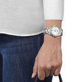 Tissot PR 100 Sport Chic 36mm T101.910.11.116.00 worn on wrist – white mother-of-pearl dial with diamond indexes, silver stainless steel case and bracelet, elegant 36mm women's quartz watch shown on wrist