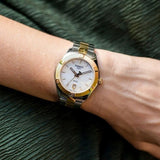 Tissot PR 100 Sport Chic 36mm T101.910.22.111.00 worn on wrist – white mother-of-pearl dial, two-tone yellow gold and steel case and bracelet, elegant 36mm profile shown on wrist
