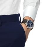 Tissot Chrono L 42mm T116.417.16.042.00 men’s chronograph watch with blue dial, stainless steel case, luminous hands, chronograph sub-dials, date display, and brown textured leather strap - on wrist