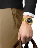 Tissot Chrono XL Classic 45mm T116.617.33.051.00 worn on wrist – black chronograph dial, yellow gold PVD case and bracelet, bold 45mm statement sport watch shown on wrist