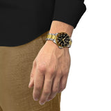 Tissot Seastar 1000 GMT 40mm T120.852.22.051.00 worn on wrist – black GMT dial, two-tone gold and grey PVD case and bracelet, bold 40mm dive sport watch shown on wrist