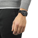 Tissot Supersport Chrono 42mm T125.417.33.051.00 worn on wrist – black chronograph dial, black PVD case with aluminium bezel, stainless steel bracelet, bold 42mm quartz chronograph shown on wrist