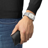 Tissot PRX Automatic 40mm T137.407.11.111.00 worn on wrist – white mother-of-pearl dial, silver integrated stainless steel case and bracelet, slim 70s-inspired profile shown on wrist