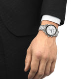 Tissot PR516 Chronograph 40mm T149.417.11.011.00 front view – white dial, PVD stainless steel case, tachymeter bezel, chronograph subdials, date window, grey stainless steel bracelet - on hand