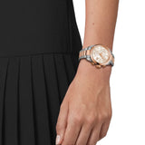 Tissot PR 100 36mm T150.217.22.111.00 worn on wrist – white mother-of-pearl chronograph dial, rose gold and steel two-tone case and bracelet, showcasing fit and scale on the wrist