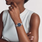 Tissot Désir 29.6mm T152.223.11.496.00 worn on wrist – blue and midnight blue moonphase dial with diamond indexes, domed stainless steel case and bracelet, elegant 29.6mm profile shown on wrist