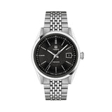 Tissot Visodate 39mm T157.407.11.051.00 front view – black dial, silver stainless steel case, Dauphine hands, index hour markers, date window, grey grains of rice stainless steel bracelet
