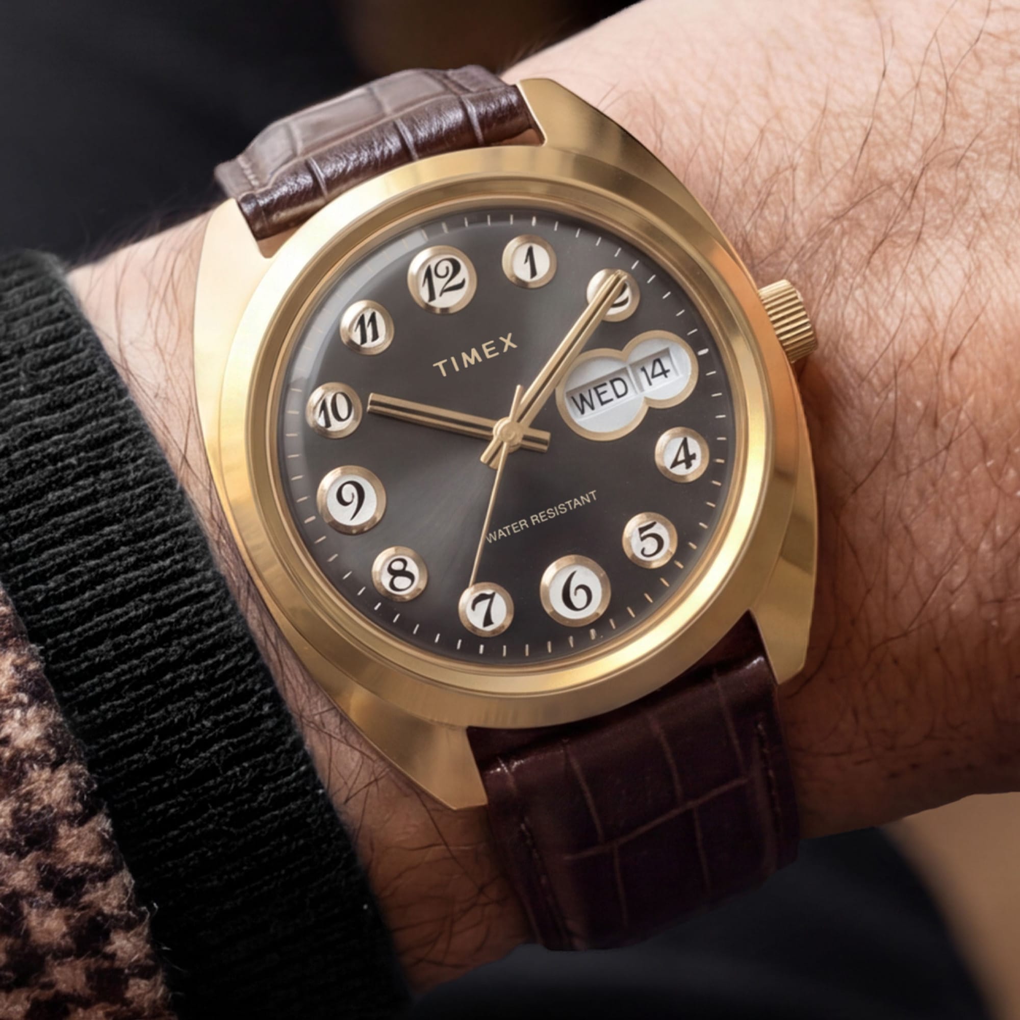 The Timex 1976 Rotary Phone Dial Reissue Quartz 37mm Watch TW2Y82100 pairs its gold-tone case with a brown leather strap for a distinctive, conversation-starting look. The 20mm strap fits wrists from 150mm to 210mm.