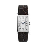 The Timex Lexington Quartz 21mm Watch TW2Y88200 features a silver dial finished with vertical brushing, elongated Roman numerals, and metallic blue hands for a subtle pop of contrast.