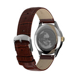 The Timex Waterbury Traditional Quartz 39mm Watch TW2Y92100 features a brown leather strap responsibly sourced from the Leather Working Group, finished with a crocodile grain texture and secured with a buckle clasp.