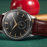 The Timex Waterbury Traditional Quartz 39mm Watch TW2Y92100 suits both the office and smart-casual dressing, worn day-to-day. The textured black dial and brown leather strap bring a timeless yet fresh look to any outfit.