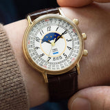 The Timex 1990 Reissue Moon Phase Quartz 37mm Watch TW2Y99000 pairs its gold-tone case with a brown crocodile-grain leather strap for a classic, considered look.