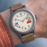 the Timex x Looney Tunes Expedition Quartz 40mm Watch TW2Y99400 pairs its gunmetal-tone case with a brown leather strap on the wrist. The slim 10mm case sits comfortably for everyday wear.