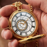 The Timex x Harry Potter Time Turner 48.5mm Pocket Watch TW2Y99600 is shown open beside a burgundy and gold Gryffindor scarf. The gold-tone case and white dial suit Harry Potter fans and collectors.