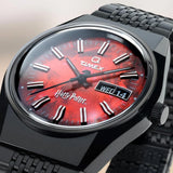The Timex x Harry Potter Sorcerer’s Stone 38mm Quartz Watch TW2Y99700 has a fiery red dial inspired by the Sorcerer’s Stone and a red wand-shaped second hand. A day and date window sits at 3 o’clock inside the black IP-coated case.