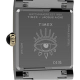 The Timex x Jacquie Aiche Éclat Quartz Women's 24mm Watch TW6A15000 has a special collaboration case back. A battery-powered quartz analog movement sits inside the case.