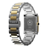 The Timex x Jacquie Aiche Éclat Quartz Women's 24mm Watch TW6A15000 is shown styled with layered gold and diamond bracelets. The rose quartz dial and two-tone finish make it easy to stack with other jewellery.