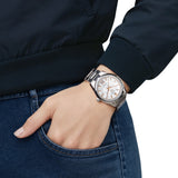 TAG Heuer Carrera Date WBN231C.BA0001 shown worn on the wrist, illustrating the case proportions and steel bracelet fit. The mother-of-pearl dial stands out against the sleeve in frame.