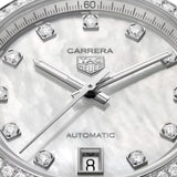 TAG Heuer Carrera Date WBN231E.BA0001 captured in extreme close-up on the mother-of-pearl dial, highlighting the diamond indexes and rhodium-plated faceted hands. The date window at 6 o'clock sits against the pearlescent dial surface.