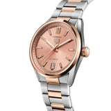 TAG Heuer Carrera Date WBN2350.BD0000 photographed at an angle highlighting the copper dial's snailed-brushed finish and rose gold bezel. The two-tone bracelet curves away from the lugs, showing its link construction.