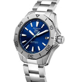 TAG Heuer Aquaracer Professional 200 Solargraph WBP1113.BA0000 photographed at an angle highlighting the blue dial's applied indexes and unidirectional bezel. The steel bracelet curves away from the lugs, showing its link construction.
