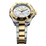 TAG Heuer Aquaracer Professional 200 Solargraph WBP1326.BB0004 photographed at an angle highlighting the mother-of-pearl dial’s diamond indexes and gold-plated turning bezel. The two-tone bracelet curves away from the lugs, showing its link construction.
