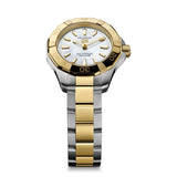 TAG Heuer Aquaracer Professional 100 Solargraph WBP1423.BB0006 photographed at an angle highlighting the mother-of-pearl dial's applied gold-plated indexes and fixed bezel. The two-tone bracelet curves away from the lugs, showing its link construction.
