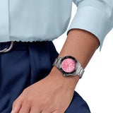 TAG Heuer Aquaracer Professional 300 Date WBP231J.BA0618 shown worn on the wrist, illustrating the case proportions and steel bracelet fit. The pink dial stands out against the sleeve in frame.