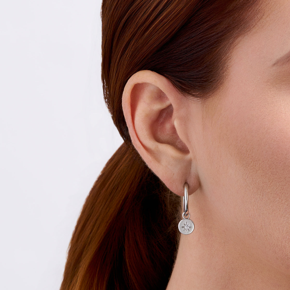 Star Cubic Zirconia Huggie Earrings in Sterling Silver