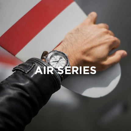 Hand wearing a Luminox watch with 'AIR SERIES' text