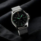 Luminox Patagonia Steel Men's 43mm Quartz Watch X2.2501.M shown in a relaxed everyday setting. This Luminox G-Collection watch features a black dial, a stainless steel case and a stainless steel mesh bracelet.