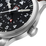 Luminox Air Pilot P-38 Lightning Men's 42mm Quartz GMT Watch XA.9521 shown in an aviation-inspired setting. This P-38 Lightning pilot's watch features a black dial, a second time zone function and a brown leather strap.
