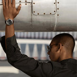 Luminox Air Pilot P-38 Lightning Men's 42mm Quartz GMT Watch XA.9521 worn on the wrist to show its size and fit. This P-38 Lightning pilot's watch features a black dial, a stainless steel case and a brown leather strap.