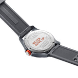 Back view of the Luminox Bear Grylls Survival Land Men's 43mm Quartz Watch XB.3716 showing the case back engraved with Bear Grylls' "Never Give Up" motto. This Bear Grylls Survival Land 3710 Series watch is water resistant to 100m.