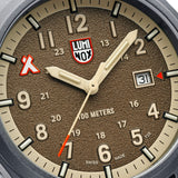 Close-up of the sand-blasted sand-coloured dial on the Luminox Bear Grylls Survival Land Men's 43mm Quartz Watch XB.3716, showing the Bear Grylls logo at 10 o'clock, luminous hands and date window. This Bear Grylls Survival Land 3710 Series watch features 14 self-powered tritium tubes for constant visibility.