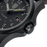 Luminox Atacama Field Men's 43mm Quartz Watch XL.1961 shown in a rugged outdoor setting. This Atacama Field blackout watch features a textured black dial, a lightweight CARBONOX™ case and 100m water resistance.