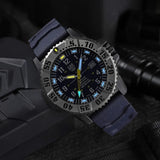 Luminox MIL-SPEC Inspired Men’s 46mm Quartz Watch XL.3355.2 shown in a rugged outdoor setting. This MIL-SPEC 3350 Series military watch features a blue dial, a titanium bezel and 300m water resistance.