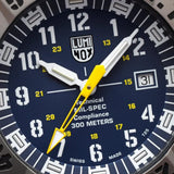 Close-up of the blue dial on the Luminox MIL-SPEC Inspired Men’s 46mm Quartz Watch XL.3355.2, showing the numerals, luminous hands and date window. This MIL-SPEC 3350 Series military watch features self-powered tritium tubes for constant visibility in the dark.