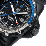 Close-up of the black dial on the Luminox RECON Nav Spec Men's 46mm Quartz GMT Watch XL.8833, showing the white 12 and 24-hour numerals, blue 9 to 12 markers, blue seconds hand and GMT hand. This RECON Nav Spec watch features self-powered tritium tubes for constant visibility in the dark.