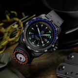Luminox RECON Nav Spec Men's 46mm Quartz GMT Watch XL.8833 shown in a rugged outdoor navigation setting. This RECON Nav Spec watch features a GMT function, a detachable compass and 200m water resistance.